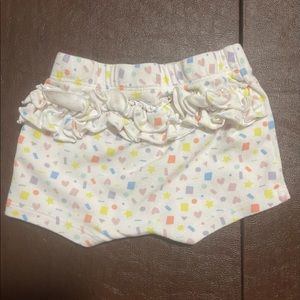 Ruffle shorts with multi colored shapes for baby